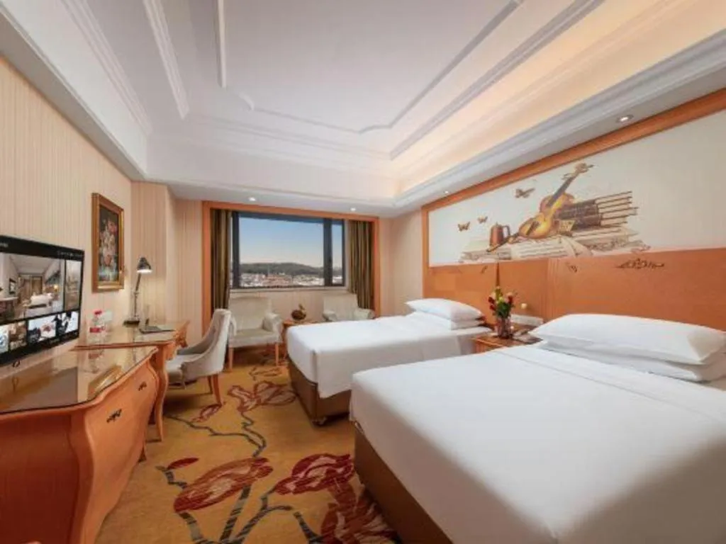 Bed in Vienna International Hotel Guangzhou Jichang Road Huangshi
