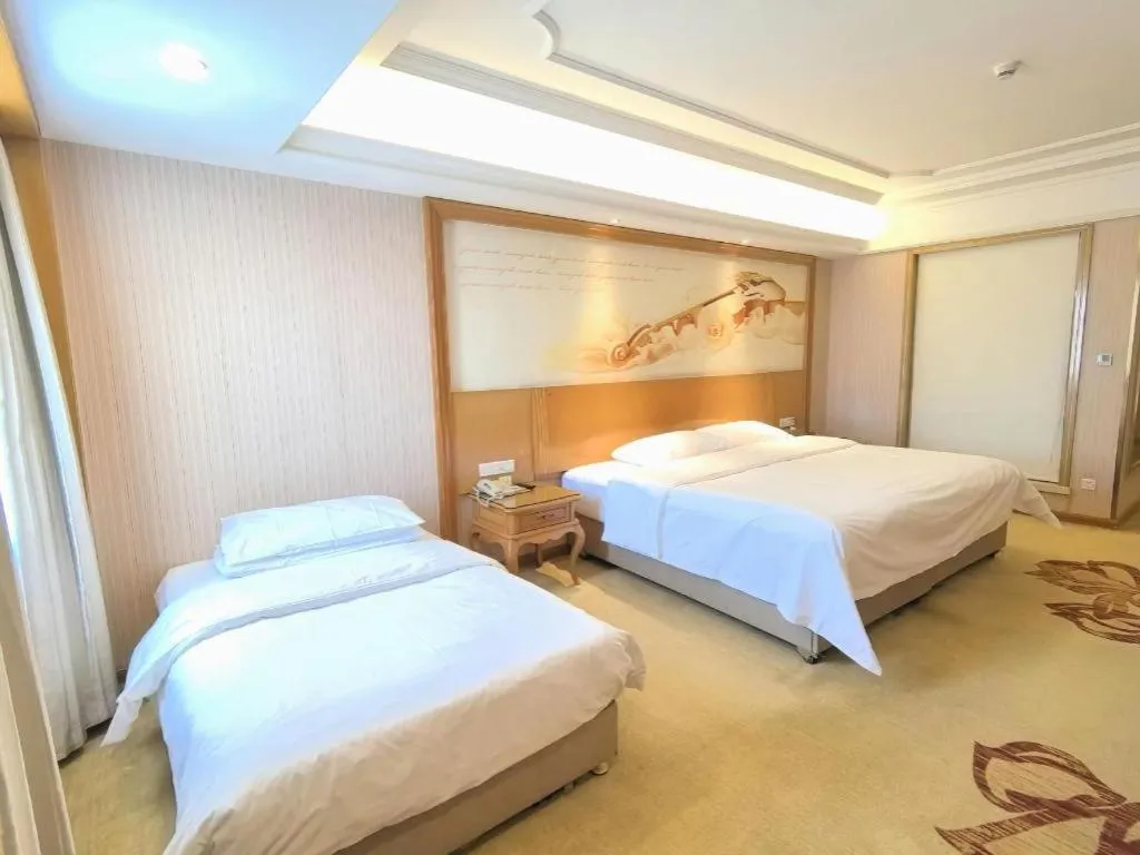 Bed in Vienna International Hotel Guangzhou Jichang Road Huangshi