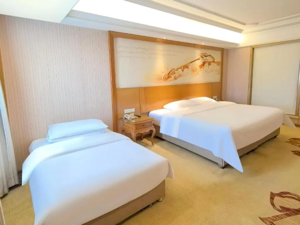 Bed in Vienna International Hotel Guangzhou Jichang Road Huangshi