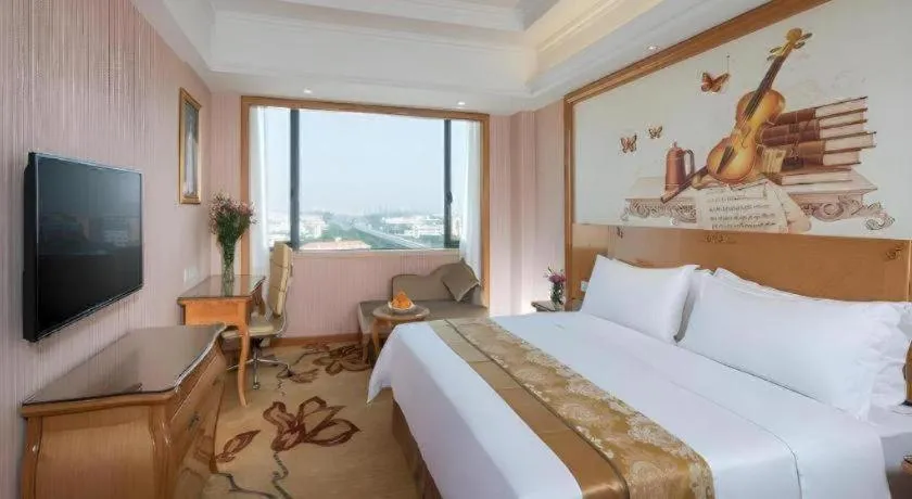 Bed in Vienna International Hotel Guangzhou Jichang Road Huangshi