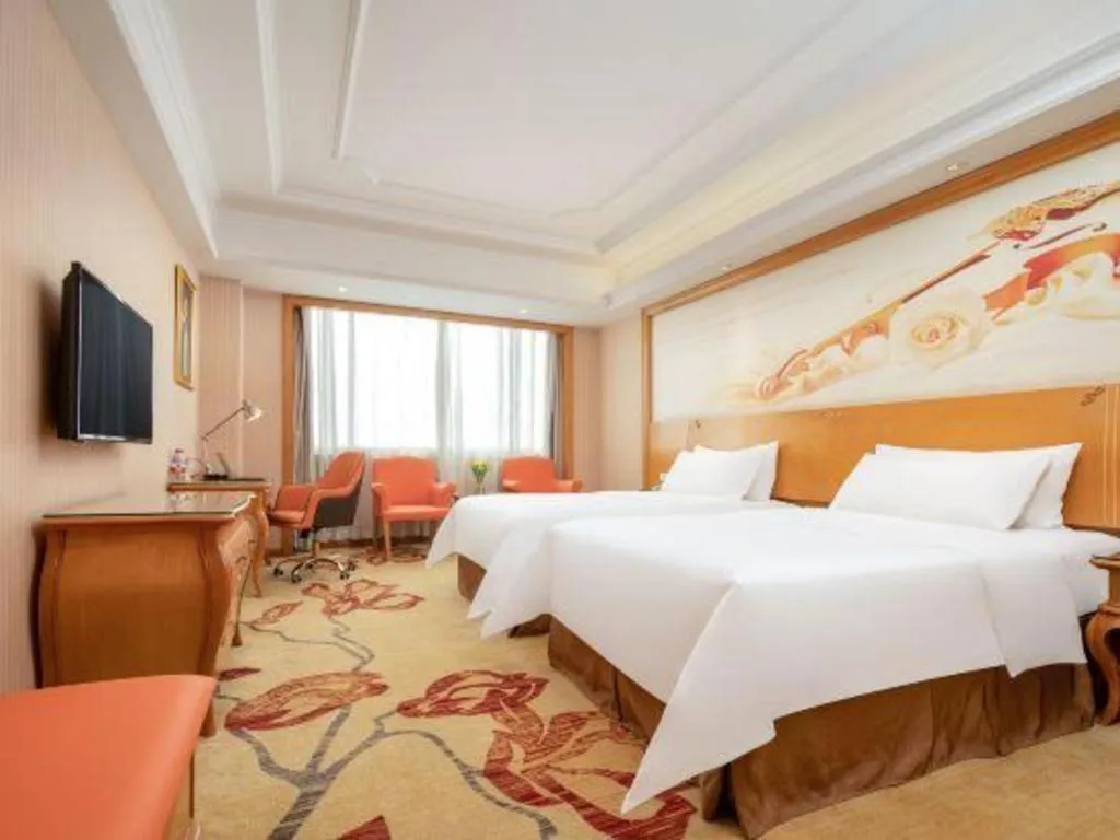 Bed in Vienna International Hotel Guangzhou Jichang Road Huangshi