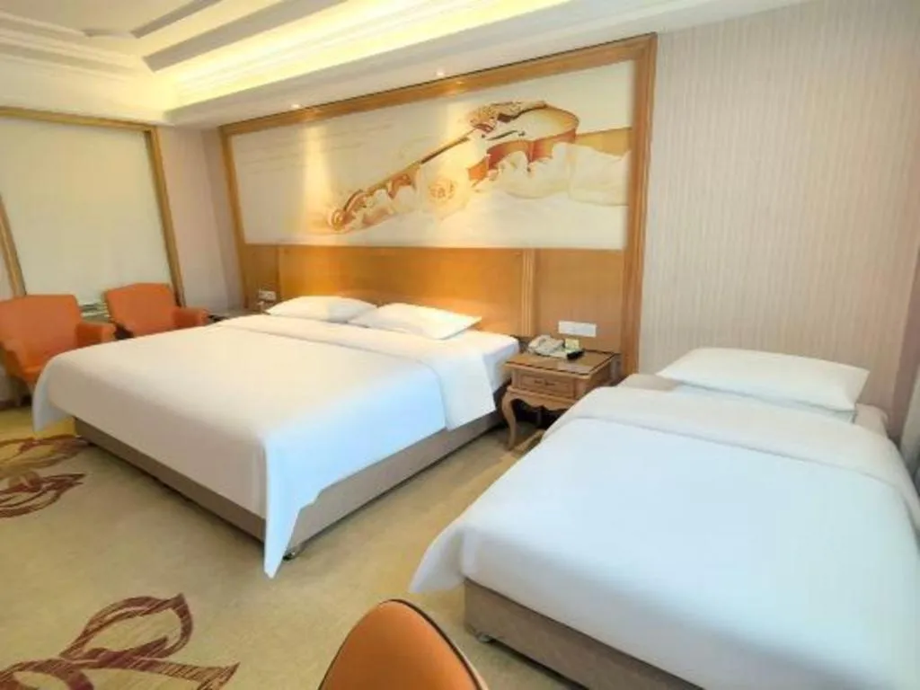 Bed in Vienna International Hotel Guangzhou Jichang Road Huangshi