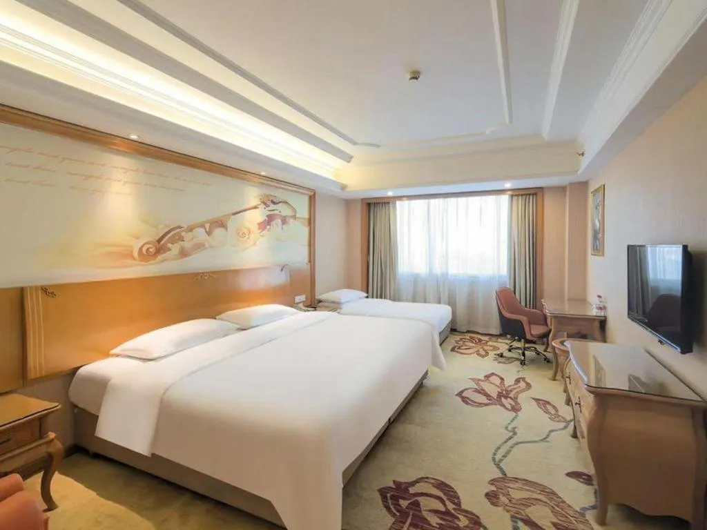 Bed in Vienna International Hotel Guangzhou Jichang Road Huangshi