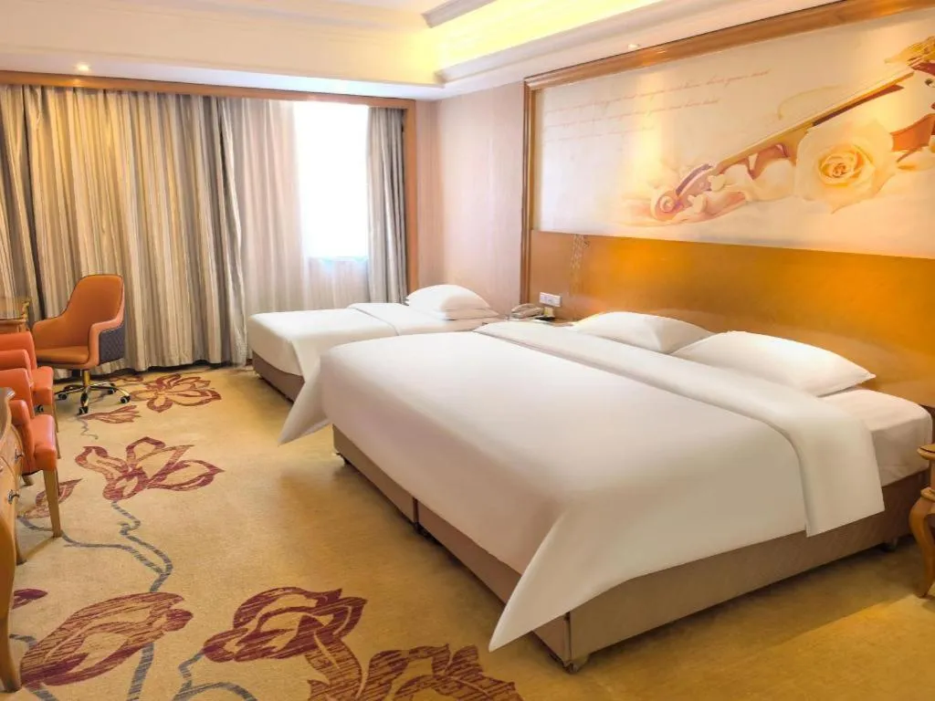 Bed in Vienna International Hotel Guangzhou Jichang Road Huangshi