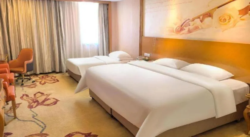 Bed in Vienna International Hotel Guangzhou Jichang Road Huangshi