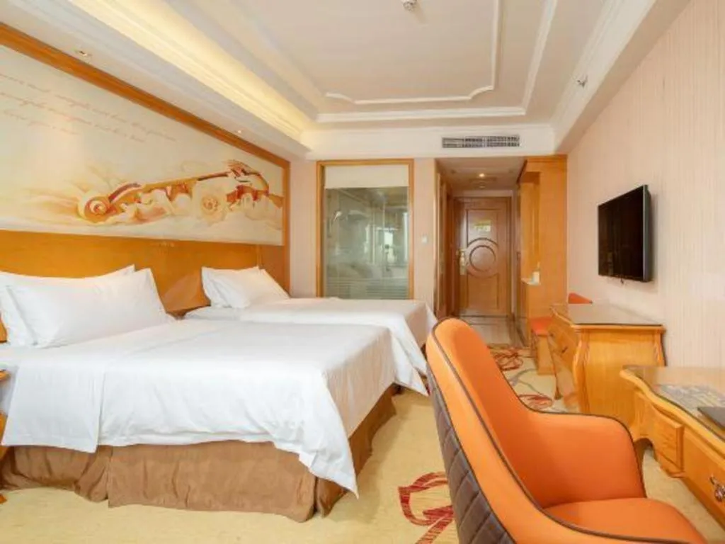 Bed in Vienna International Hotel Guangzhou Jichang Road Huangshi