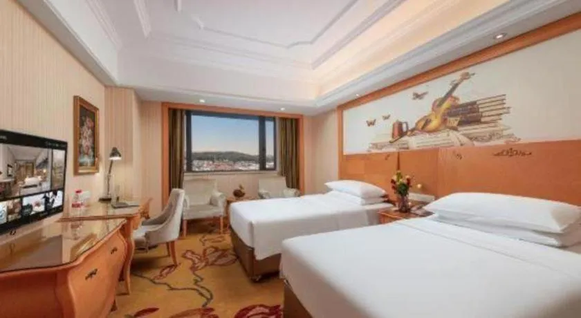 Bed in Vienna International Hotel Guangzhou Jichang Road Huangshi