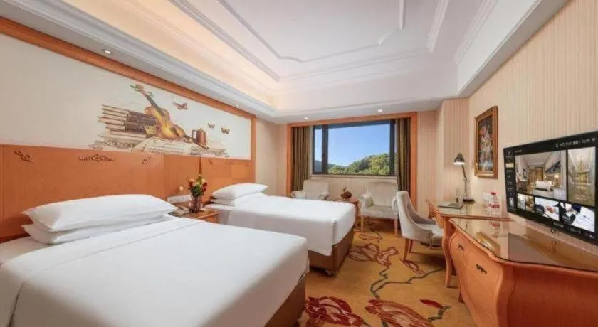 Bed in Vienna International Hotel Guangzhou Jichang Road Huangshi