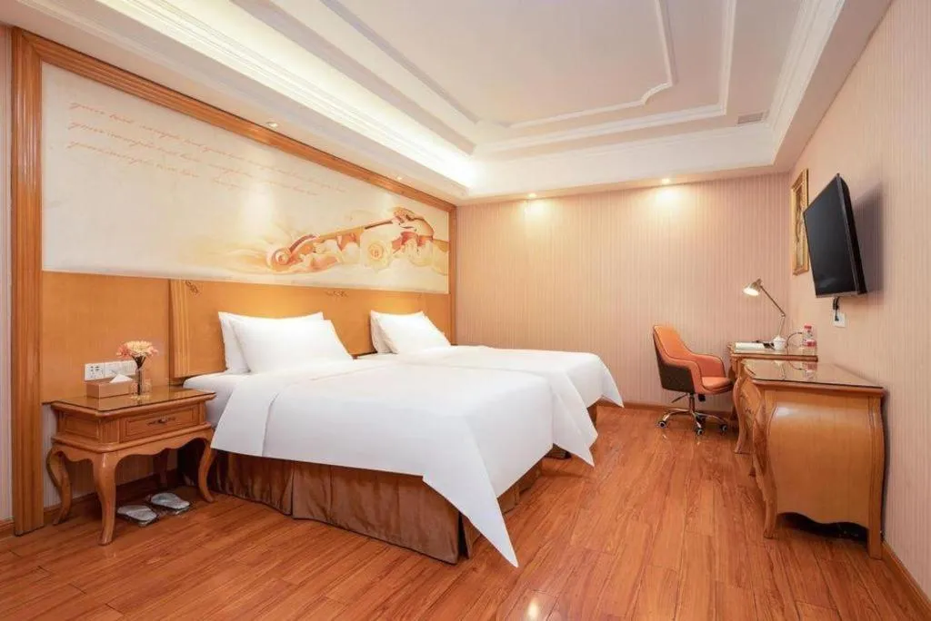 Bed in Vienna International Hotel Guangzhou Jichang Road Huangshi