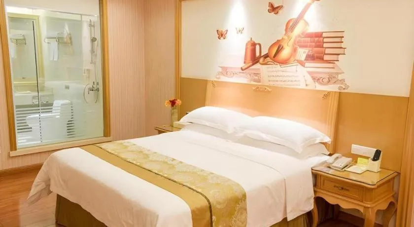 Bed in Vienna International Hotel Guangzhou Jichang Road Huangshi