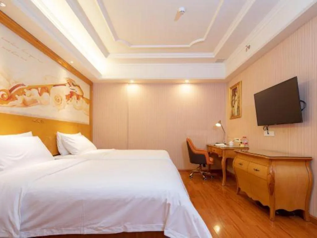 Bed in Vienna International Hotel Guangzhou Jichang Road Huangshi