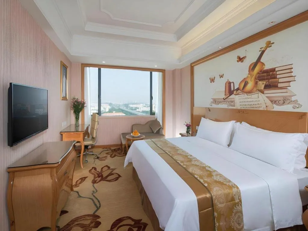 Bed in Vienna International Hotel Guangzhou Jichang Road Huangshi