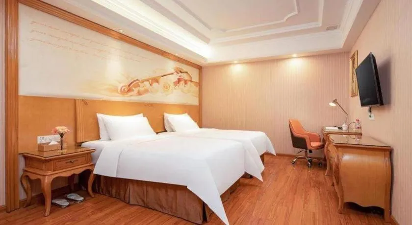 Bed in Vienna International Hotel Guangzhou Jichang Road Huangshi