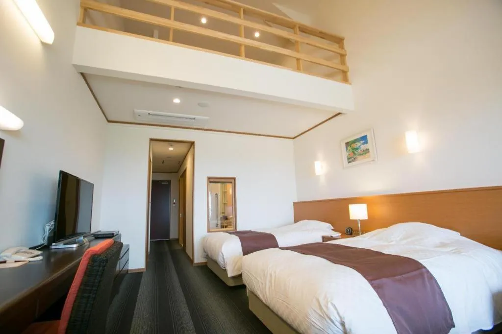 Bed in Sakura Resort Hotel Ishigaki