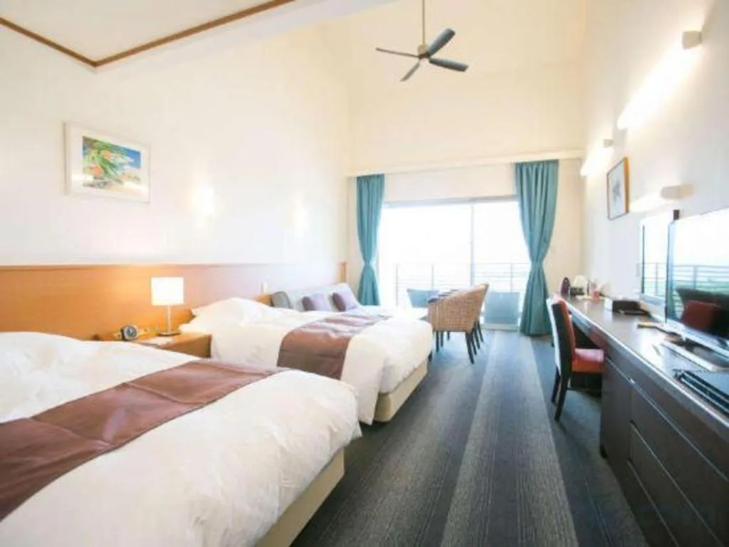 Bed in Sakura Resort Hotel Ishigaki
