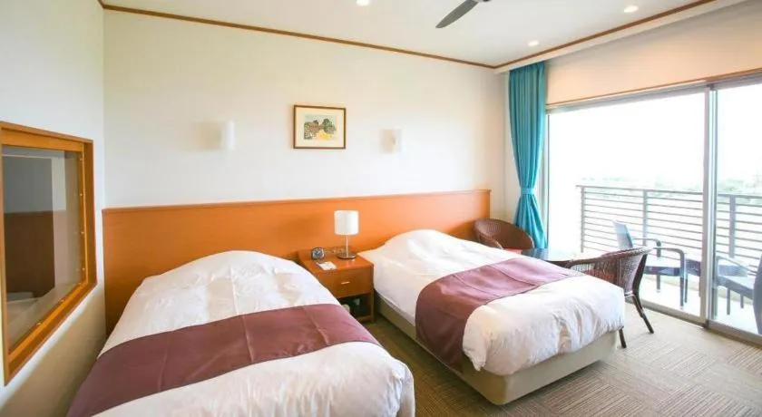 Bed in Sakura Resort Hotel Ishigaki