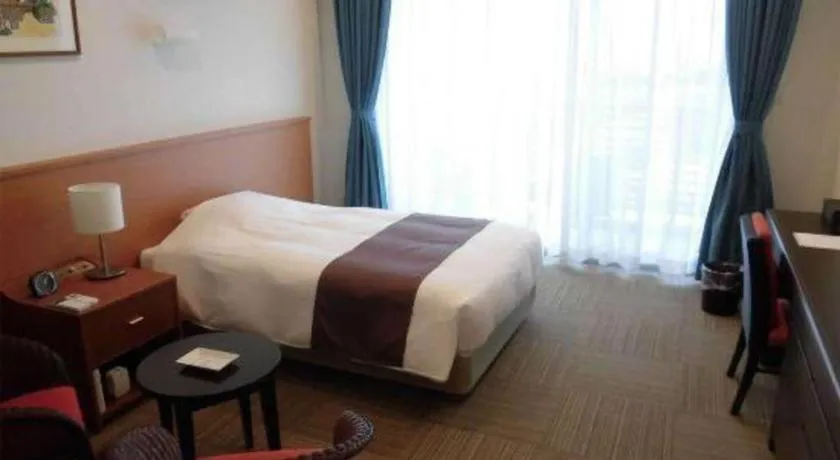 Bed in Sakura Resort Hotel Ishigaki