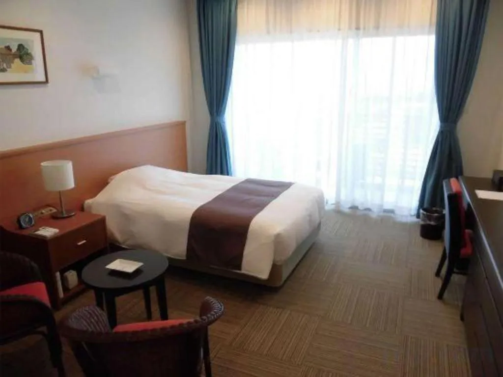 Bed in Sakura Resort Hotel Ishigaki