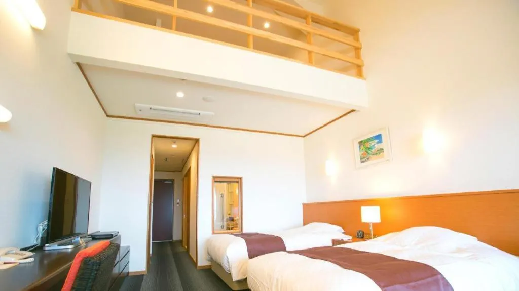 Bed in Sakura Resort Hotel Ishigaki