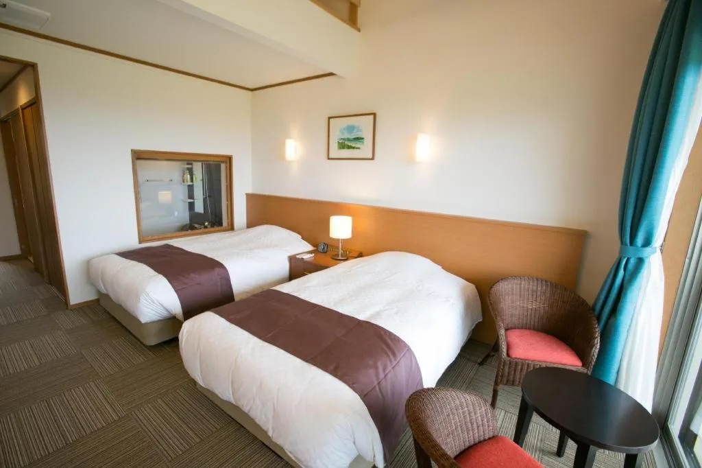 Bed in Sakura Resort Hotel Ishigaki