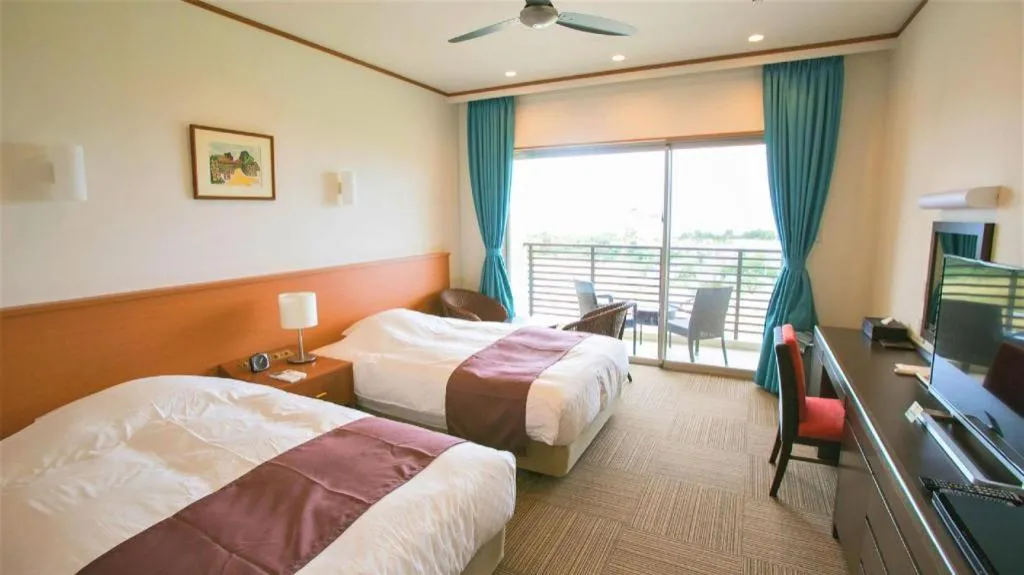 Bed in Sakura Resort Hotel Ishigaki