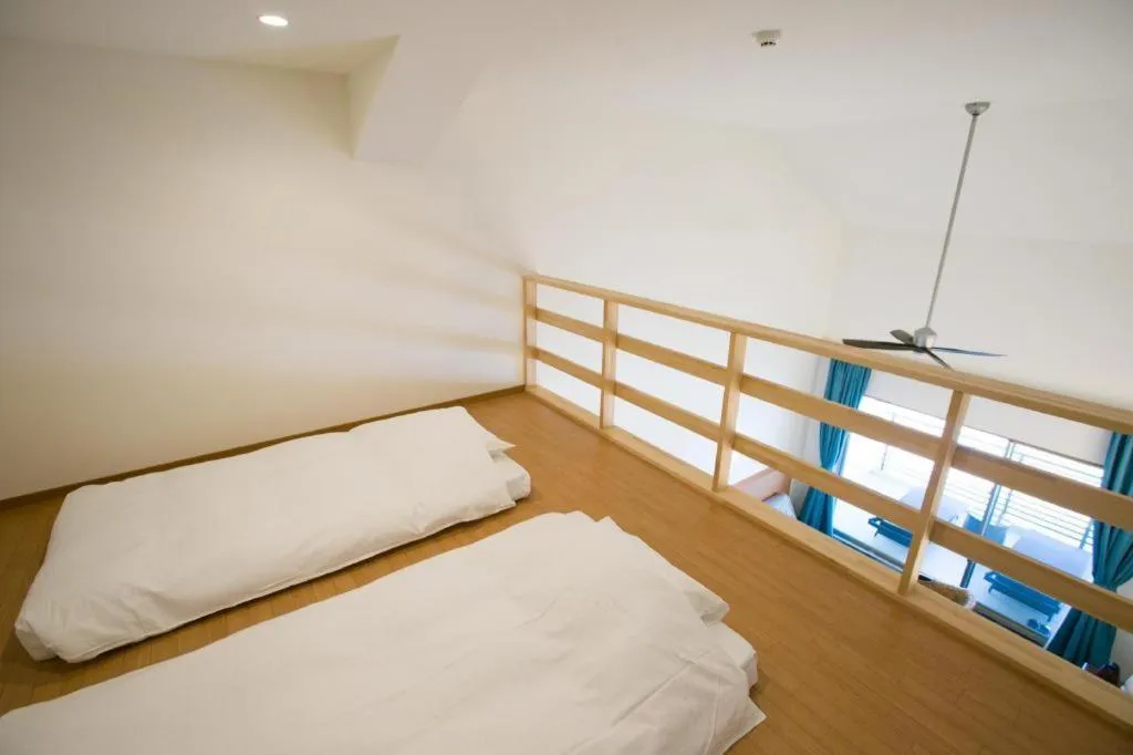 Bed in Sakura Resort Hotel Ishigaki