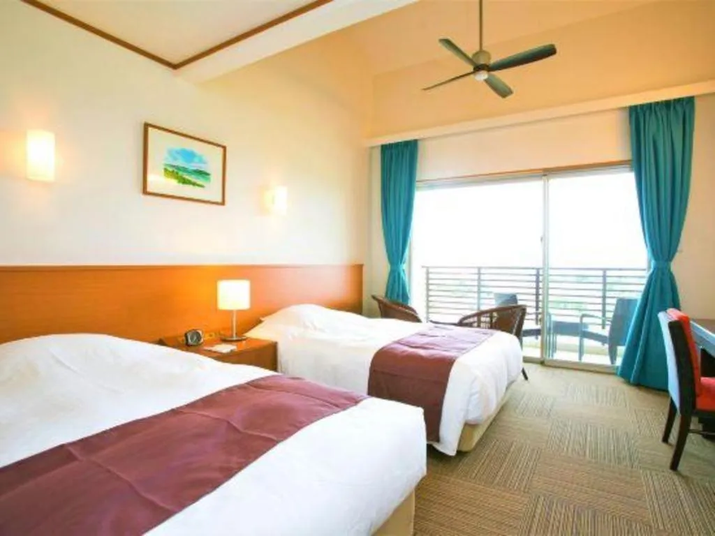 Bed in Sakura Resort Hotel Ishigaki