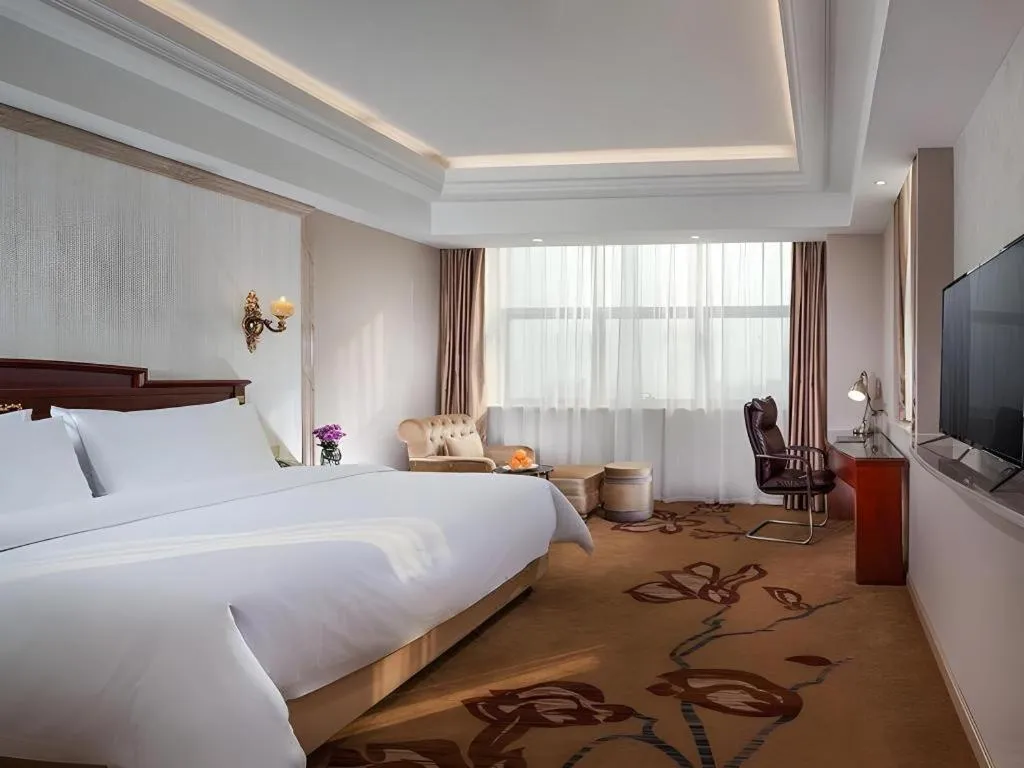 Bed in Vienna International Hotel Wuxi Taihu Expo Center