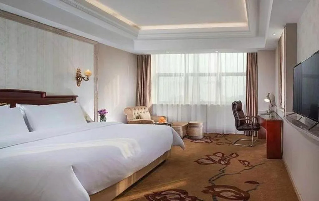 Bed in Vienna International Hotel Wuxi Taihu Expo Center