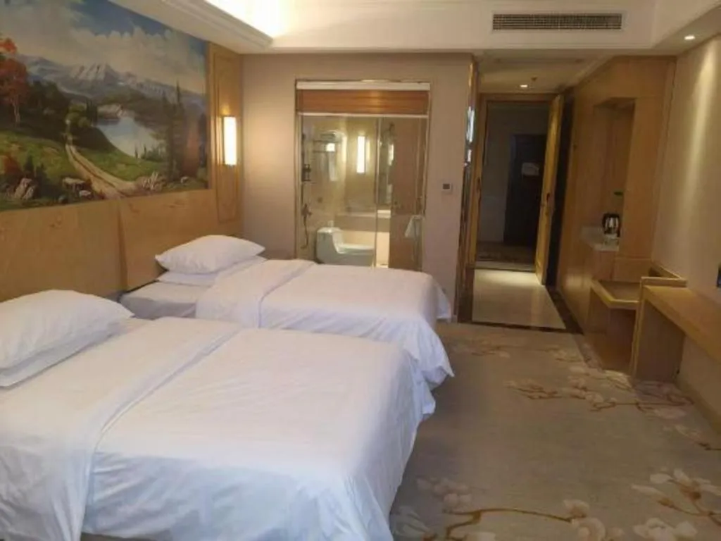 Bed in Vienna International Hotel Wuxi Taihu Expo Center