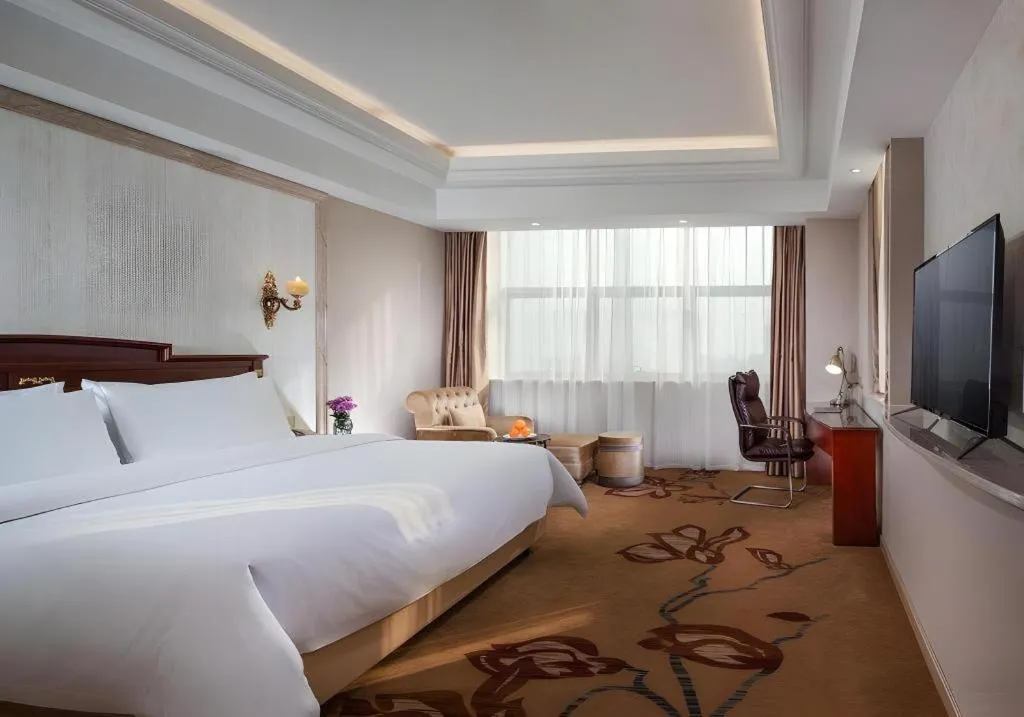 Bed in Vienna International Hotel Wuxi Taihu Expo Center