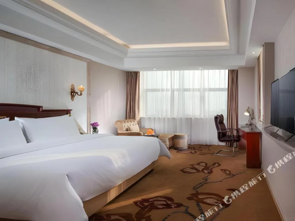 Bed in Vienna International Hotel Wuxi Taihu Expo Center