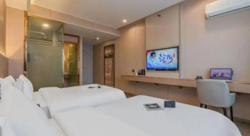 Bed in Vienna Hotel Shenzhen Pinghu Shuangyong Street Metro Station
