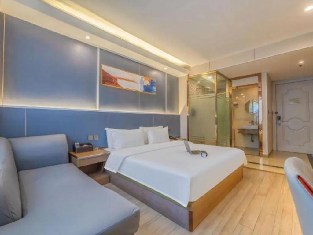 Bed in Vienna Hotel Shenzhen Pinghu Shuangyong Street Metro Station