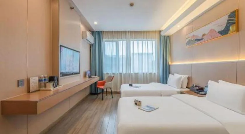 Bed in Vienna Hotel Shenzhen Pinghu Shuangyong Street Metro Station