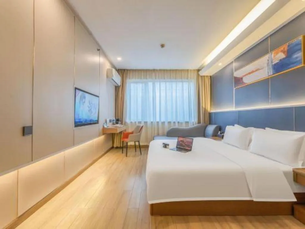 Bed in Vienna Hotel Shenzhen Pinghu Shuangyong Street Metro Station
