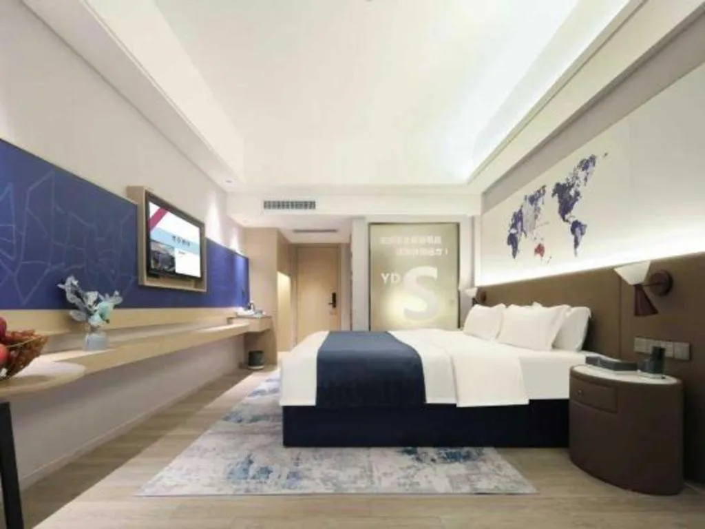 Bed in Vienna Hotel Shenzhen Pinghu Shuangyong Street Metro Station