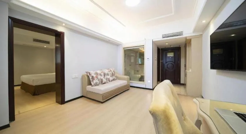 Bed in Vienna Hotel Shenzhen Pinghu Shuangyong Street Metro Station