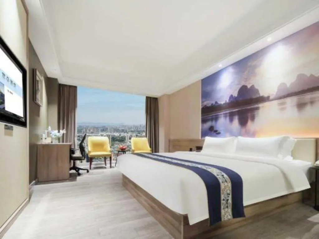 Bed in Vienna Hotel Shenzhen Pinghu Shuangyong Street Metro Station