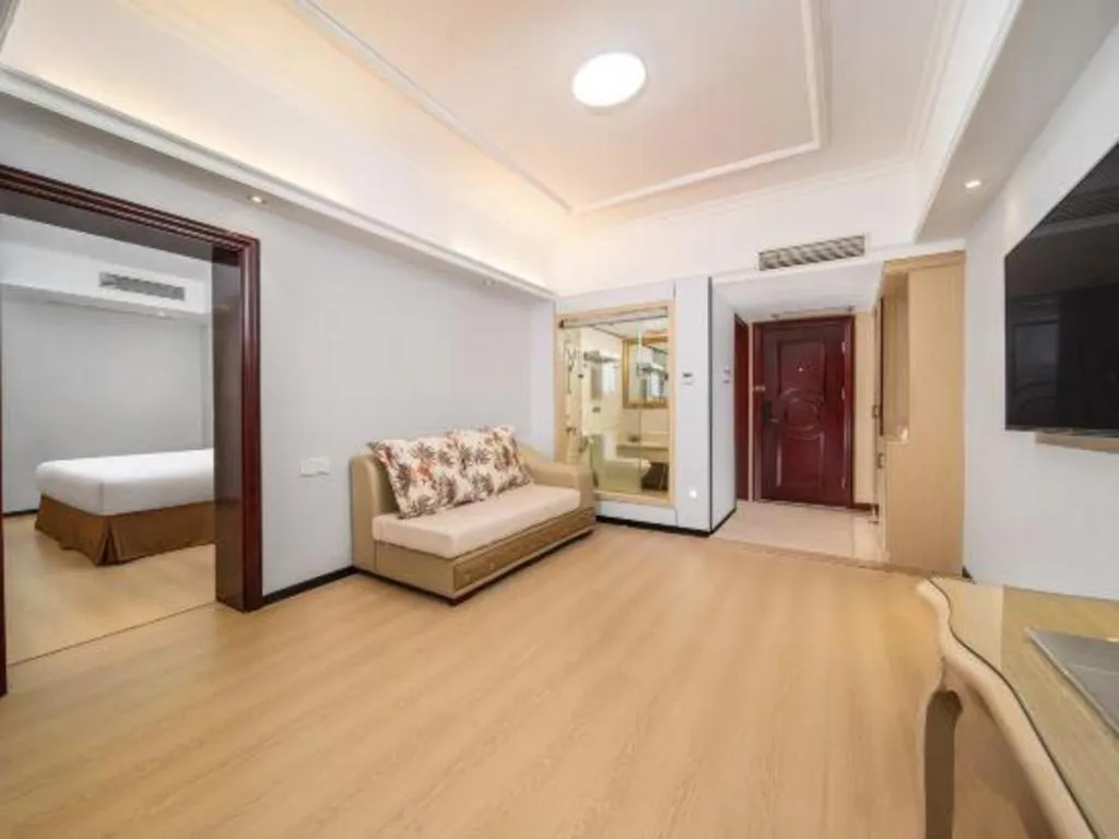 Bed in Vienna Hotel Shenzhen Pinghu Shuangyong Street Metro Station