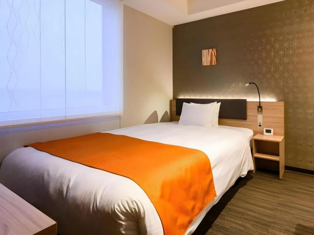 Bed in KEIKYU EX INN Haneda Innovation City 2 minutes walk from HICity Exit of Tenkubashi Station