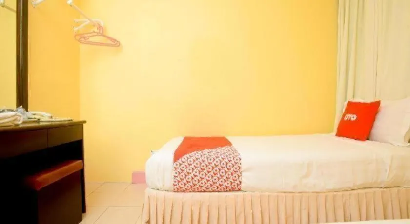 Bed in OYO 89958 Hotel Umimas