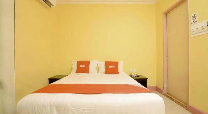 Bed in OYO 89958 Hotel Umimas