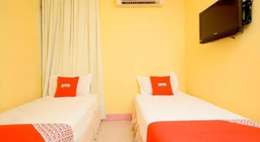 Bed in OYO 89958 Hotel Umimas