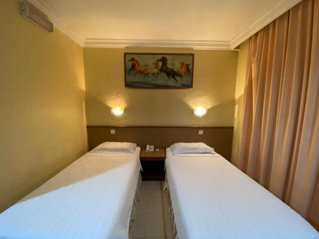 Bed in OYO 89958 Hotel Umimas