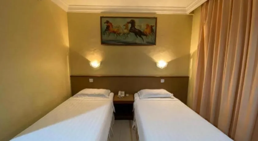 Bed in OYO 89958 Hotel Umimas