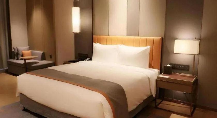 Bed in Hui Feng Wan Yun Hotel Hefei
