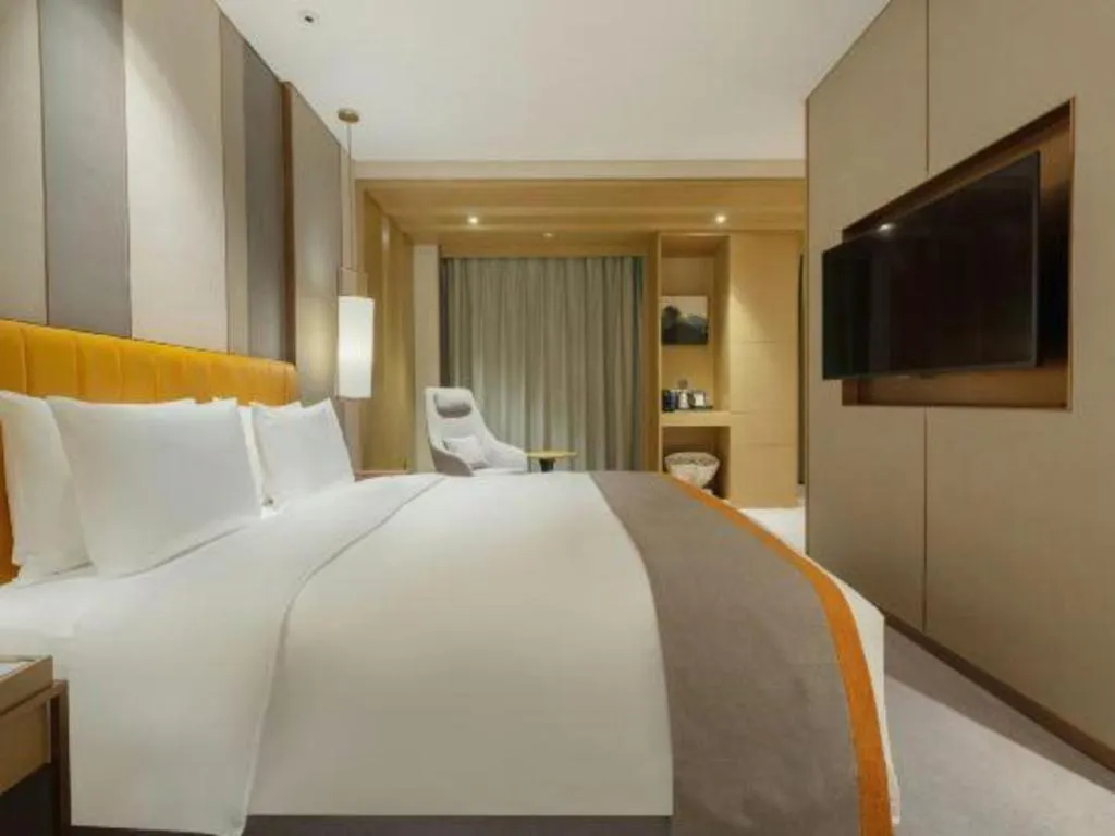 Bed in Hui Feng Wan Yun Hotel Hefei