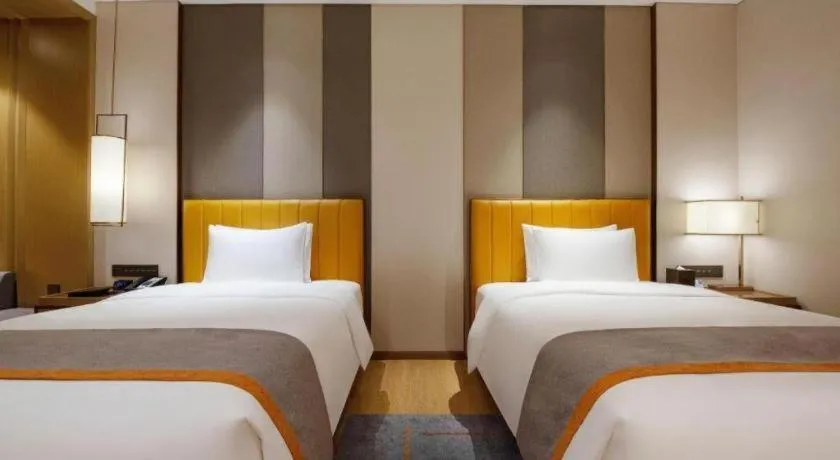 Bed in Hui Feng Wan Yun Hotel Hefei