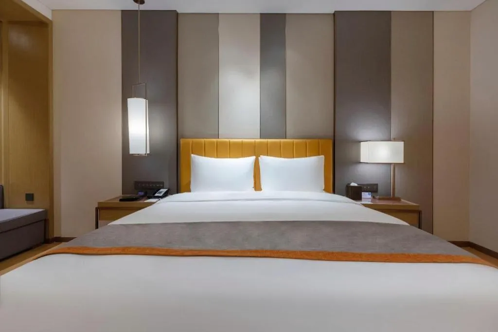 Bed in Hui Feng Wan Yun Hotel Hefei